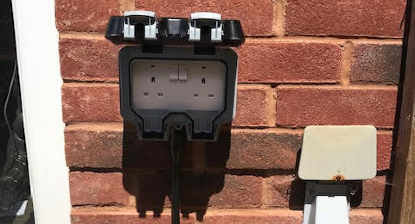External socket installation on brick wall in Warrington
