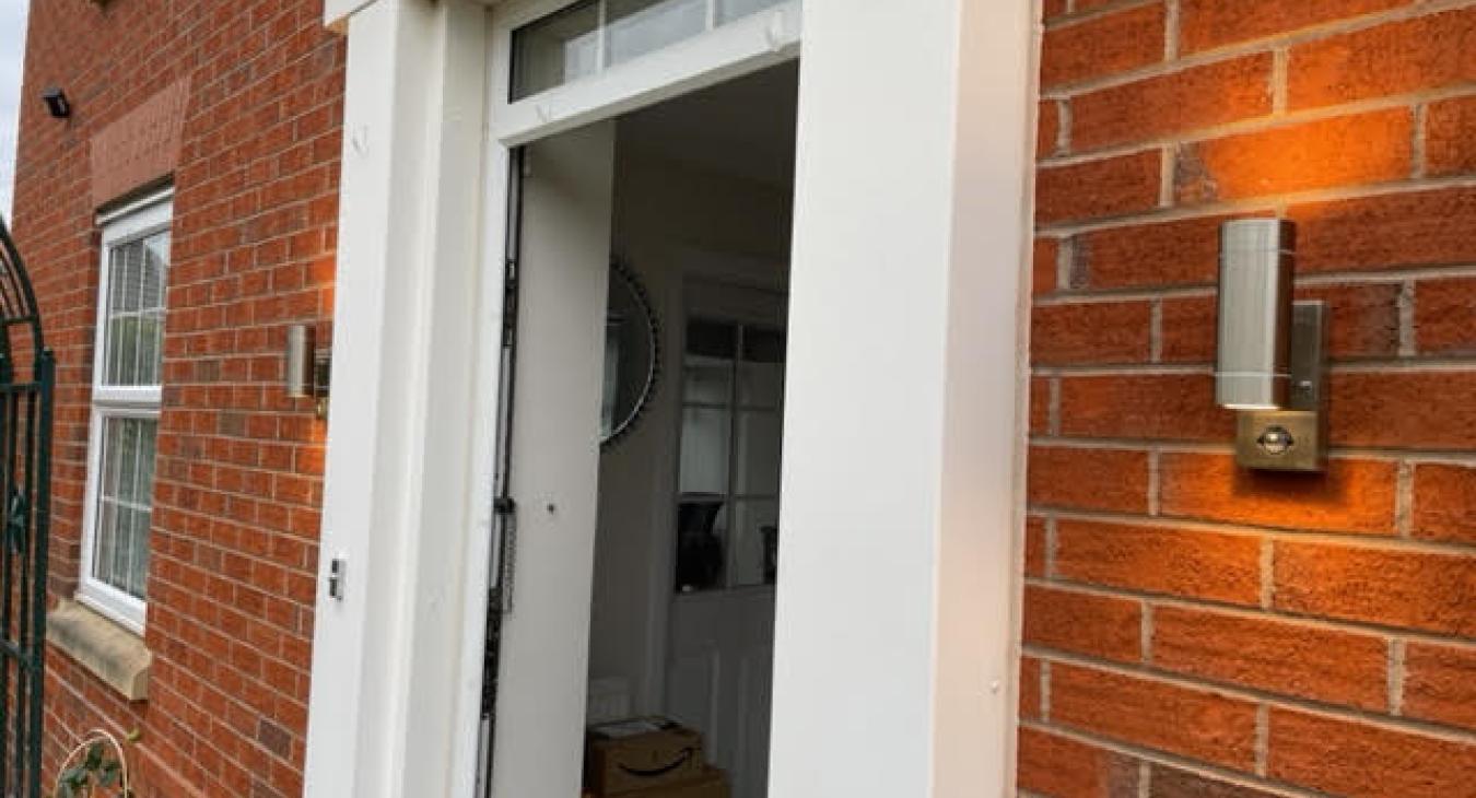 External lighting installation alongside doorway in Warrington